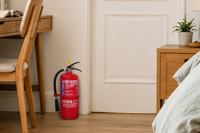 3kg fire extinguisher by a bedroom door