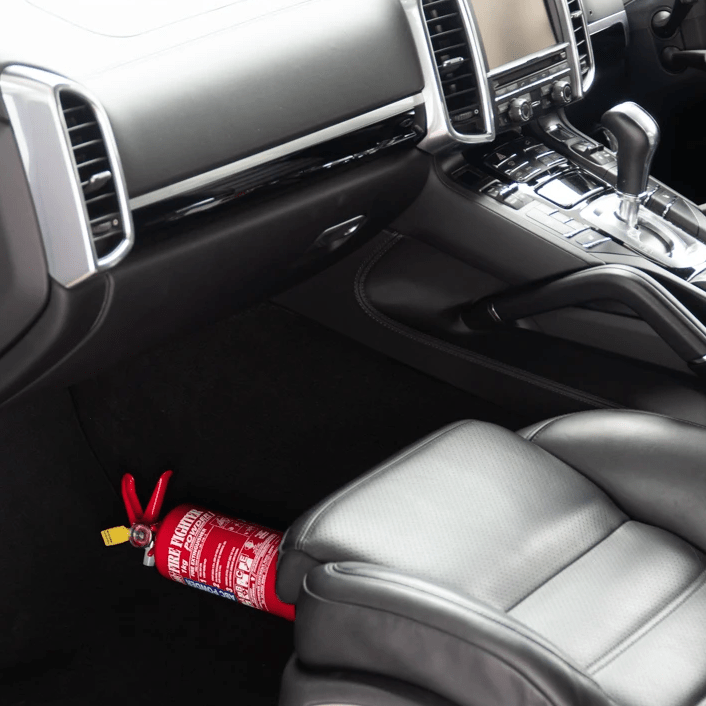 1kg extinguisher fitted in a car beside the front seat