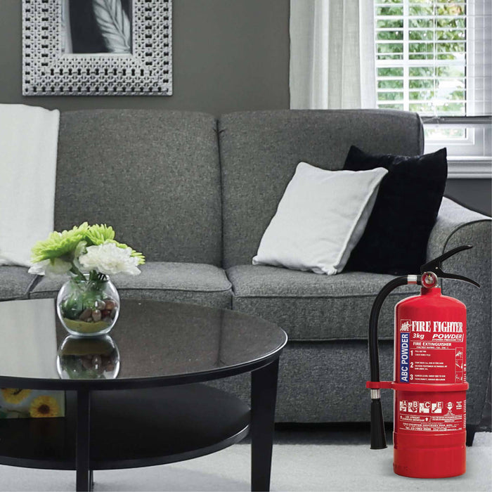 3kg fire extinguisher beside a sofa